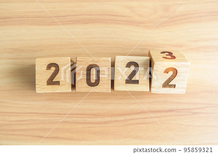 2022 change to 2023 year block on table background. goal, Resolution, strategy, plan, start, budget, mission, action, motivation and New Year concepts 95859321