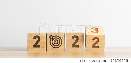 2022 change to 2023 Year block with dartboard icon. Goal, Target, Resolution, strategy, plan, Action, mission, motivation, and New Year start concepts 95859336