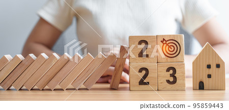 falling blocks with 2023 Year protect house miniature. Inflation financial, Home Insurance, investment, Crisis, Economic recession, New Year, Real Estate and Property concept falling blocks with 2023 Year protect house miniature. Inflation financial, Home Insurance, investment, Crisis, Economic recession, New Year, Real Estate and Property concept 95859443