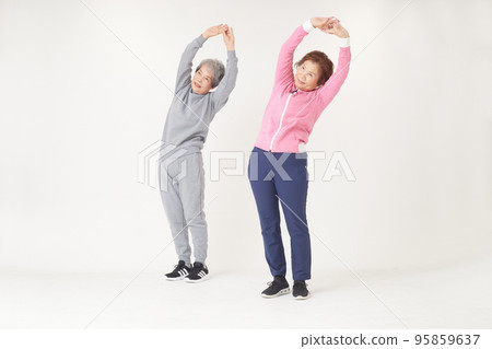 Two senior women stretching Two senior women stretching 95859637