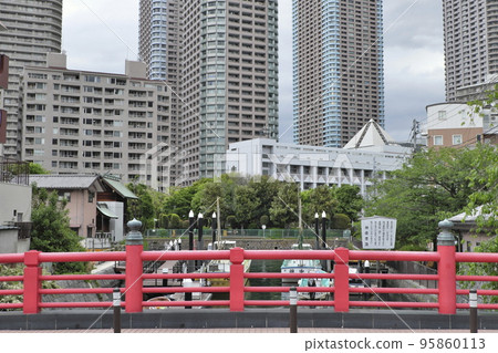 Tsukuda Island Vermilion Railings of Tsukuda Kobashi Bridge and Skyscraper Apartment in River City 95860113