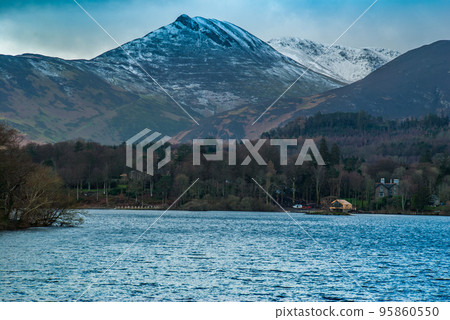 Derwent Waterand and Skiddaw mountain in background. 95860550