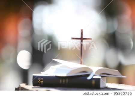Church bright light background with holy bible and the cross of salvation of Jesus Christ 95860736