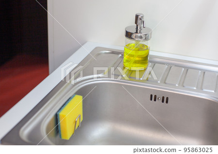 Sponge for washing dishes. Storage ideas, sink in the kitchen. Sponge for washing dishes. Storage ideas, sink in the kitchen. 95863025