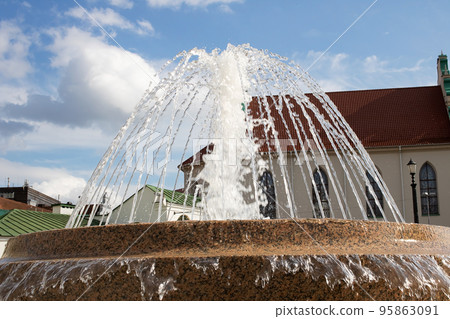 Jet of water in the fountain, green dirty water 95863091