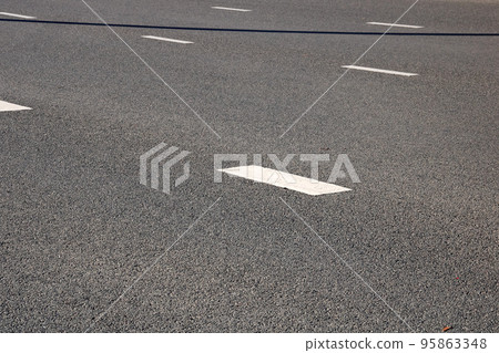 Dividing strip on a wide road closeup 95863348