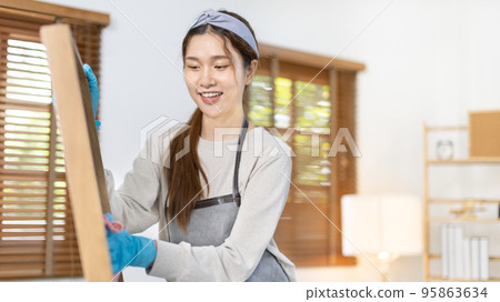 Beautiful housewife is cleaning things and Wipe the mirror in her dressing room, Big cleaning, Housework, Daily routine ,Removes germs and dirt and deep stains, Spray alcohol, Clean up on weekends. Beautiful housewife is cleaning things and Wipe the mirror in her dressing room, Big cleaning, Housework, Daily routine ,Removes germs and dirt and deep stains, Spray alcohol, Clean up on weekends. 95863634