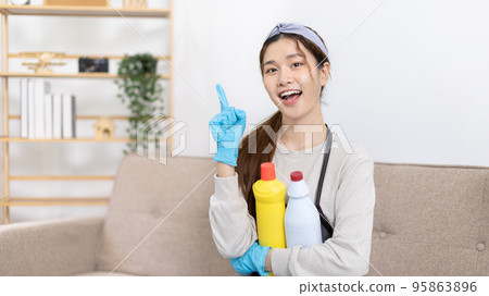 Beautiful Asian housewife wearing apron and cleaning gloves prepares to clean her house, Housework, Daily routine, Big cleaning, Clean and remove germs and dirt in the house, Clean up on weekends. Beautiful Asian housewife wearing apron and cleaning gloves prepares to clean her house, Housework, Daily routine, Big cleaning, Clean and remove germs and dirt in the house, Clean up on weekends. 95863896