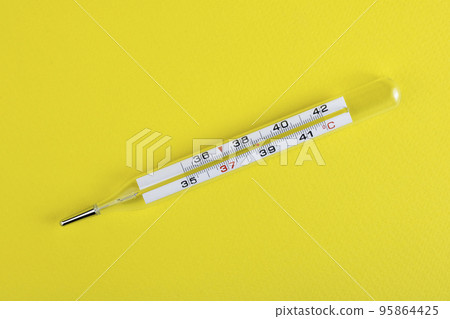 Medical device thermometer isolated on a yellow background. High temperature. Medical device. The concept of medicine. Copy space 95864425