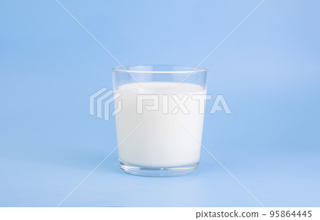 Fresh farm milk, fermented milk product, in a glass cup, on a holoumny background. Selective focus. Copy space Fresh farm milk, fermented milk product, in a glass cup, on a holoumny background. Selective focus. Copy space 95864445