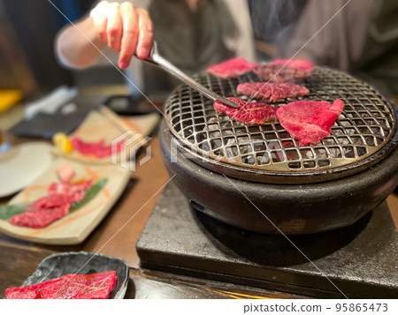 Meat magistrate at a yakiniku restaurant Meat magistrate at a yakiniku restaurant 95865473