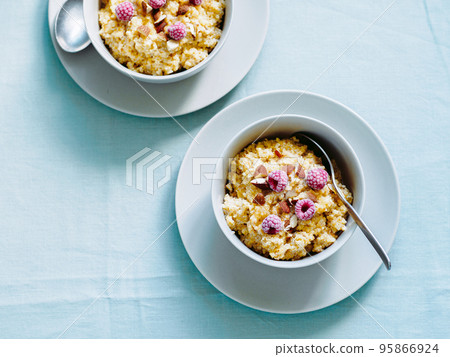 Quinoa porrige with raspberries and almond Quinoa porrige with raspberries and almond 95866924