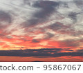 Autumn dusk with clouds dyed in madder red and purple clouds 95867067