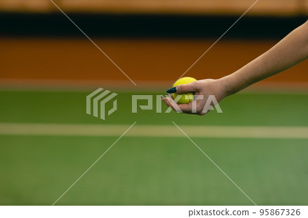 Tennis woman player playing training with racket and ball at court 95867326