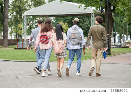 group of students walking together. Concepts of friendship and l group of students walking together. Concepts of friendship and l 95868631