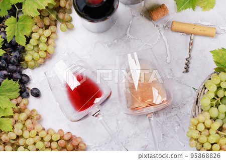 White, rose and red wine bottles and glasses 95868826