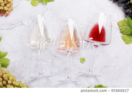 White, rose and red wine glasses and grape White, rose and red wine glasses and grape 95868827