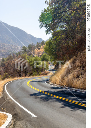 Asphalt road and countryside landscape 95869508