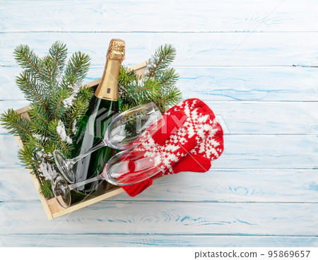 Christmas gift box with champagne bottle Christmas gift box with champagne bottle 95869657