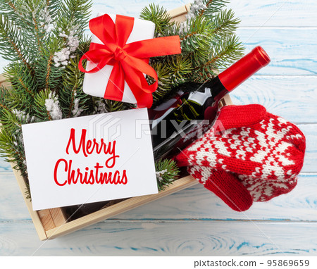 Christmas gift box with champagne bottle Christmas gift box with champagne bottle 95869659
