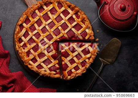 Sweet raspberry and strawberry jam cake 95869663