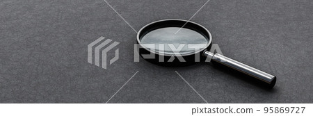 Magnifier Glass on Dark Background with Copy Space Magnifier Glass on Dark Background with Copy Space 95869727