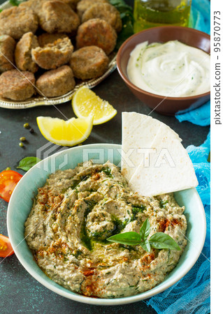 Arabic cuisine. Fresh homemade creamy mung hummus. Ramadan food. 95870773
