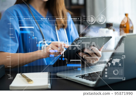 Project manager working and update tasks with Gantt chart scheduling diagram at hospital .success smart medical doctor working with smart medical doctor concept.. Project manager working and update tasks with Gantt chart scheduling diagram at hospital .success smart medical doctor working with smart medical doctor concept.. 95871990