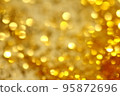 Abstract background of golden glitter small bokeh 95872696