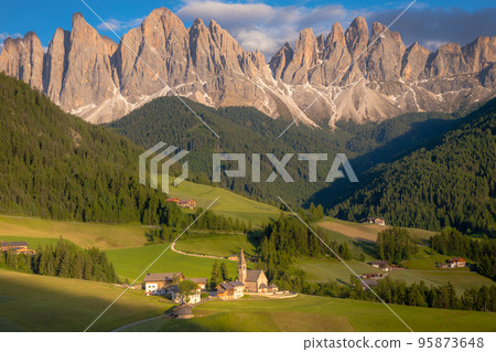 St. Magdalena with famous church in Val di Funes at sunset, Dolomites , Italy St. Magdalena with famous church in Val di Funes at sunset, Dolomites , Italy 95873648