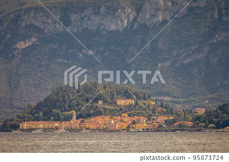 Mountain and Bellagio skyline view from Lake Como at sunset, northern Italy 95873724