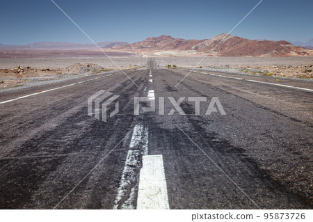 Asphalt road in Atacama desert, volcanic arid landscape in Chile, South America Asphalt road in Atacama desert, volcanic arid landscape in Chile, South America 95873726