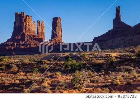 The Mittens, buttes in Monument Valley at sunrise, Arizona and Utah, USA The Mittens, buttes in Monument Valley at sunrise, Arizona and Utah, USA 95873728