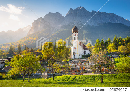 Church St Johannes, Wetterstein, Waxenstein and Zugspitze at sunrise, Grainau 95874027