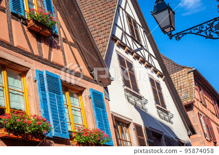 Riquewihr alsatian architecture at springtime with flowers, Eastern France 95874058