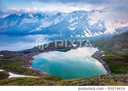 Lake near Gavia pass at dramatic evening, Dolomites alps, Northern Italy Lake near Gavia pass at dramatic evening, Dolomites alps, Northern Italy 95874614