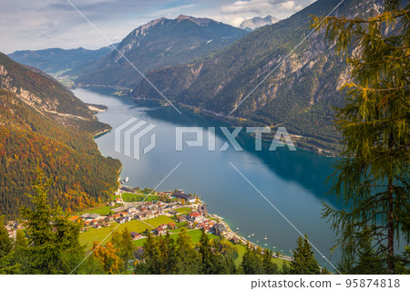 Sailboats in Achensee lake near Innsbruck at peaceful autumn, Tyrol , Austria Sailboats in Achensee lake near Innsbruck at peaceful autumn, Tyrol , Austria 95874818