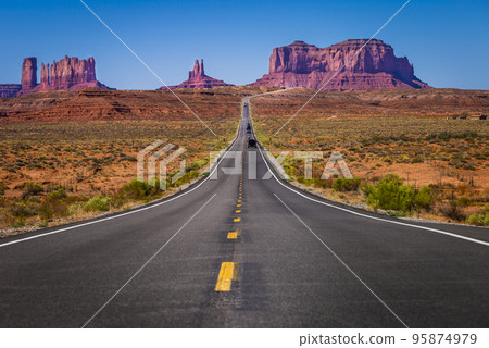 Highway Road U.S. Highway 163 and Monument Valley at sunset, Arizona, USA Highway Road U.S. Highway 163 and Monument Valley at sunset, Arizona, USA 95874979