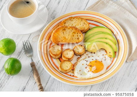 Fried eggs with avocado Fried eggs with avocado 95875058