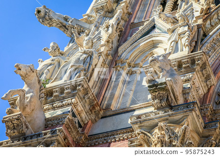 Medieval ancient and ornate cathedral at clear sky, Tuscany, Italy 95875243