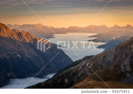 Misty valley from above Grossglockner and mountain landscape at dawn, Austria Misty valley from above Grossglockner and mountain landscape at dawn, Austria 95875951
