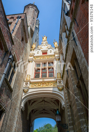facade on historic Justice Palace from low angle, Bruges, Belgium 95876148
