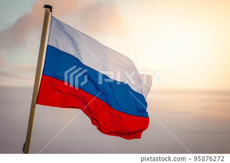 Flag of Russia waving in the wind at golden sunset, Moscow, Russia 95876272