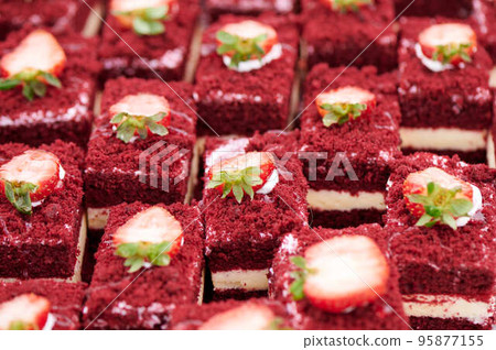 Beautiful delicious juicy cakes with red sponge cake and strawberries Beautiful delicious juicy cakes with red sponge cake and strawberries 95877155