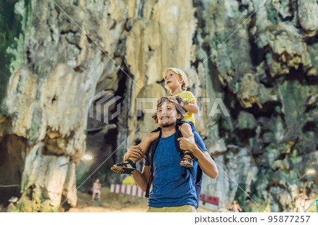 Father and son in the background of Batu Caves, near Kuala Lumpur, Malaysia. Traveling with children concept Father and son in the background of Batu Caves, near Kuala Lumpur, Malaysia. Traveling with children concept 95877257