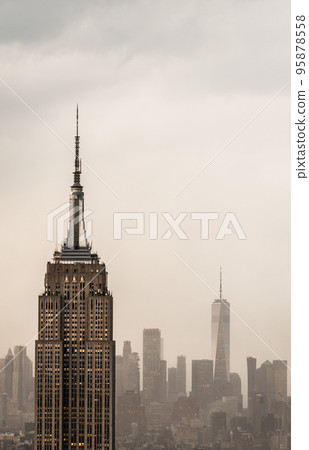 Futuristic view of a skyscraper tower in a light haze of fog or smog 95878558