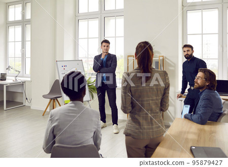 Young Professionals diverse people hold morning meeting with team startup in conference room 95879427