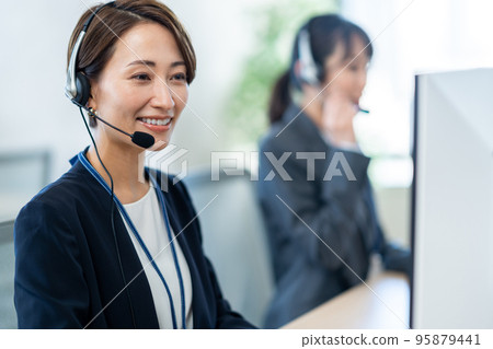 A woman who works in a call center. A woman who works in a call center. 95879441