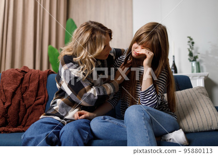 Caring mother helps her daughter overcome teenage problems. Support from Mom in a difficult time 95880113