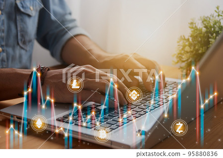 Casual Businessman Using or Typing Laptop and Color Cryptocurrency Market Bar Chart or Graph Trend 95880836